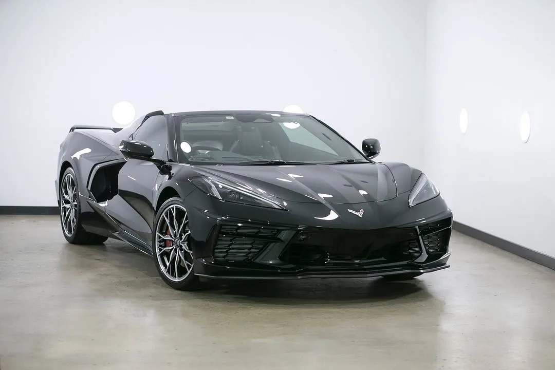 A black Corvette convertible in the studio