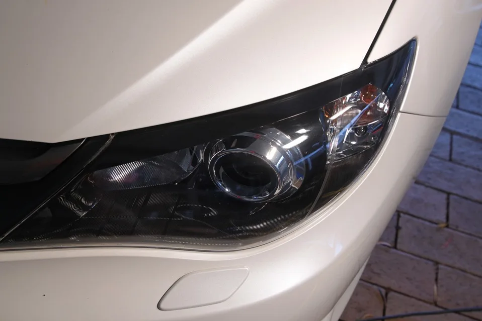 The same Subaru Impreza headlight, clear after restoration