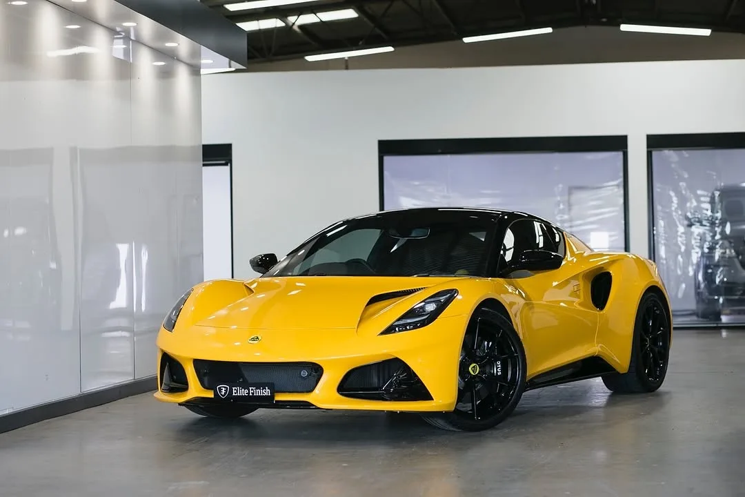 A yellow Lotus Emira in the studio